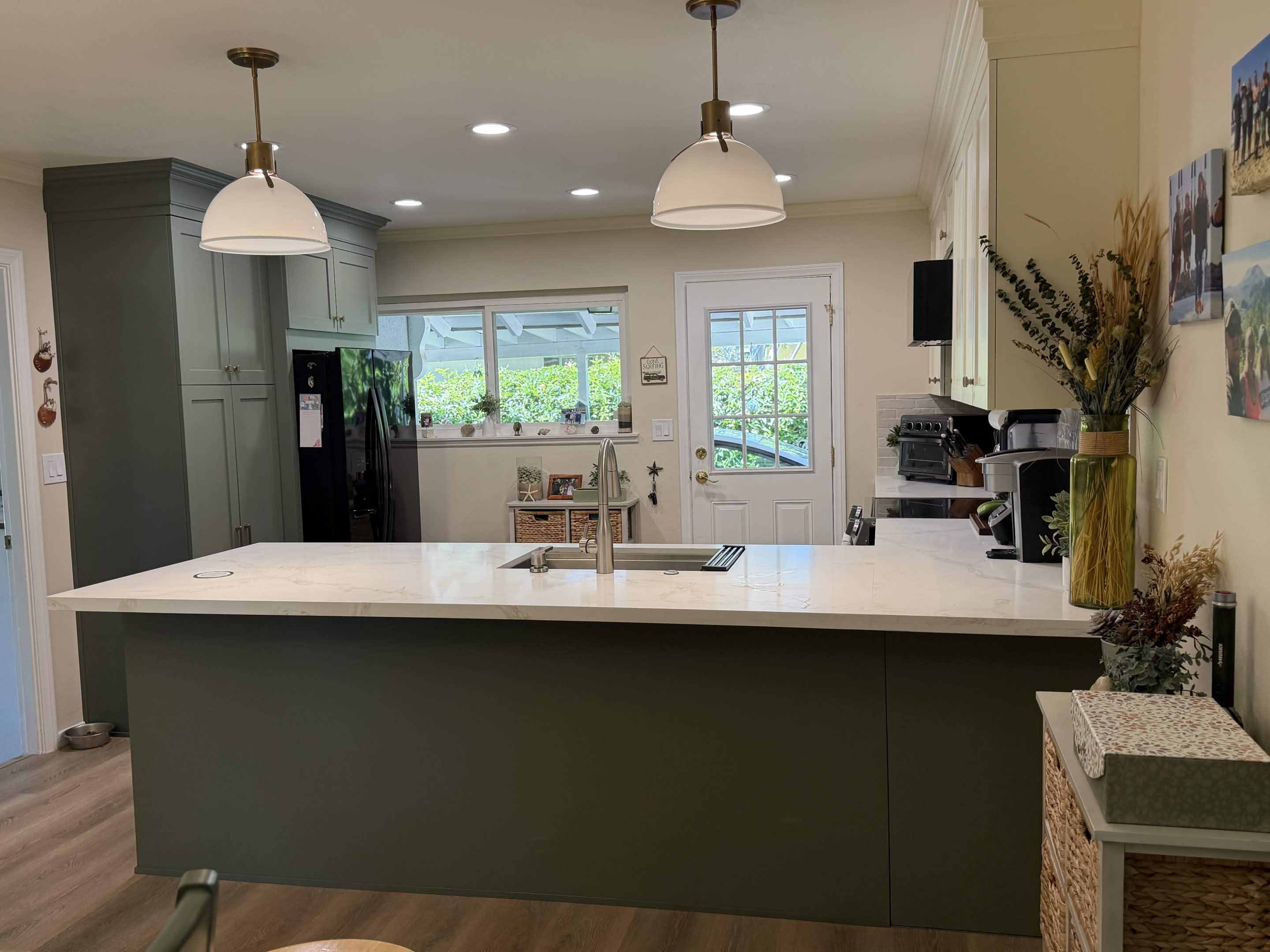 Completed sage and white kitchen remodel